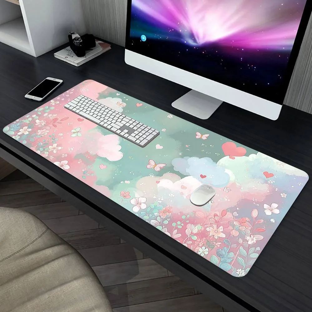 The mouse pad in pastel colors features patterns of flowers and hearts. The design also includes cute butterflies and clouds.