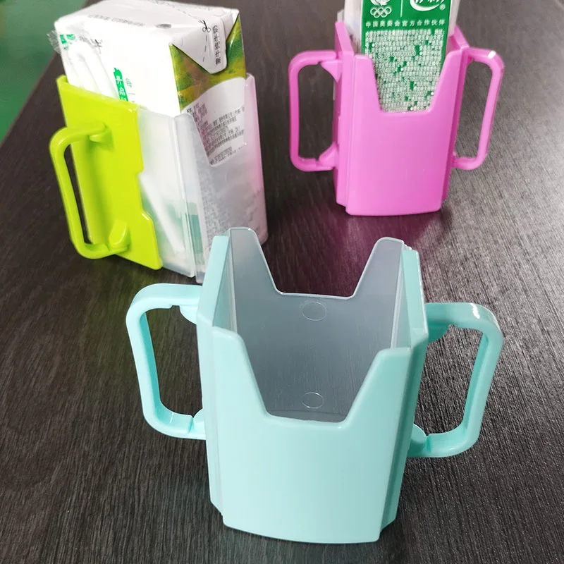 

Universal Adjustable Milk Box Holder with Handle Suit for Baby Food Pouches & Milk & Juice Boxes Prevent Squeezing Spills