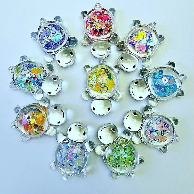 10 randomly selected glow-in-the-dark resin turtle figurines in blind bags, perfect for decorating as mini ornaments