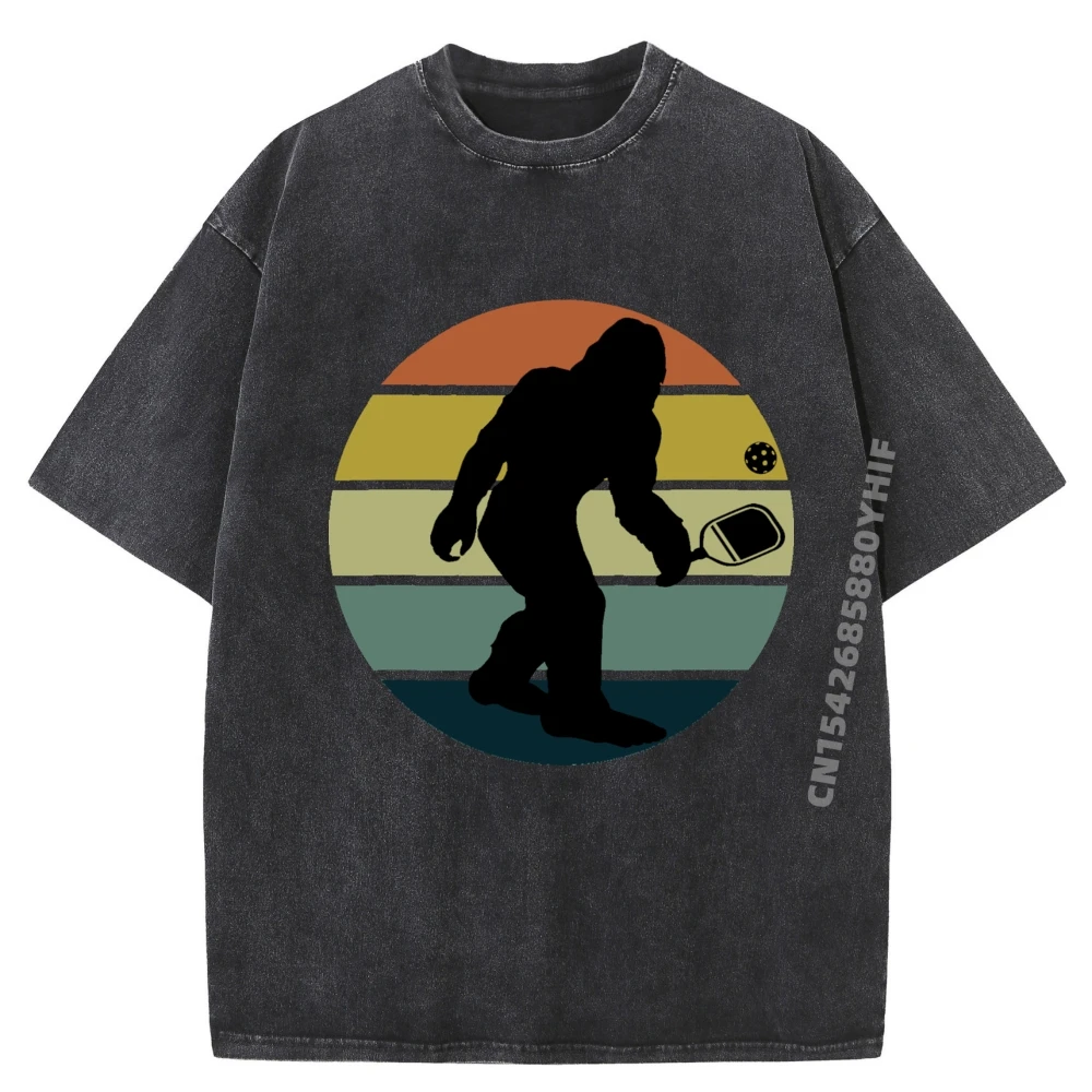 

Funny Pickleball Bigfoot Playing Pickleball Sasquatch White Graphic Tee Mens Printed Washed Short Sleeve T-Shirt