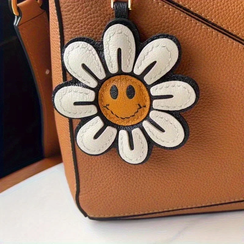 1 portachiavi girasole con faccia gioiosa e fiore, accessorio per auto in ecopelle, decorazione alla moda per borse e telefoni, idea regalo