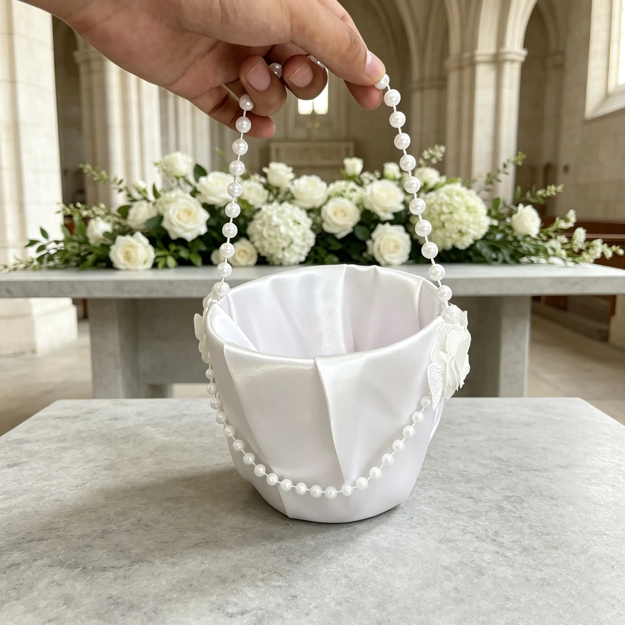 A simple butterfly-themed flower basket for the flower girls at a wedding ceremony