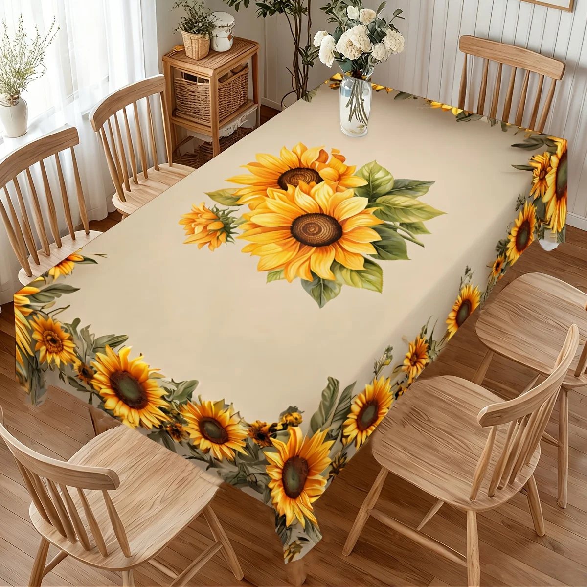 One spring and summer yellow sunflower pattern tablecloth. Commonly uses bright festive decorations and green leaves.