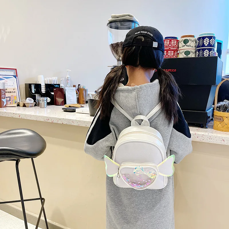 Mochila de PU con forma de corazón para niña, morral escolar transparente con forma de corazón y lazo para guardería, tendencia que combina con todo, BG132