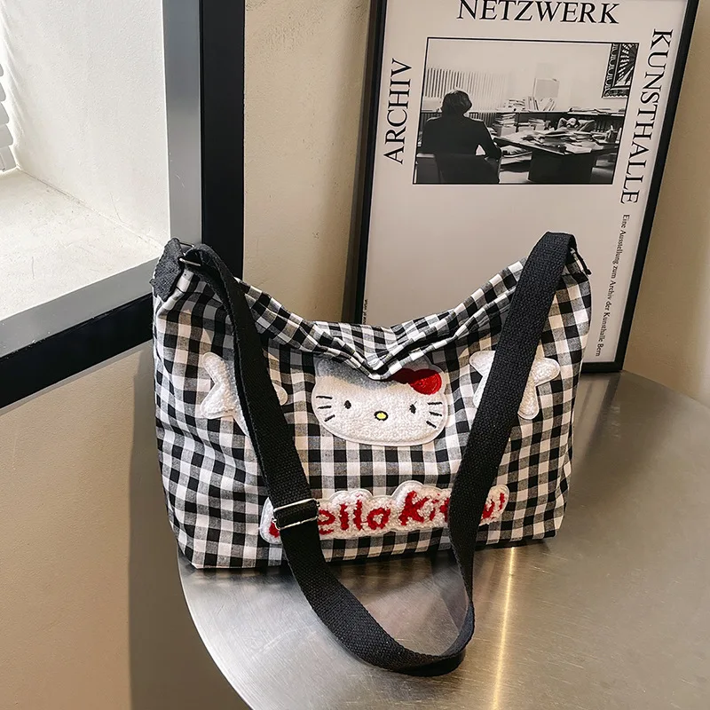 حقيبة كتف منقوشة ناعمة لطيفة من Hello Kitty للسيدات ذات سعة كبيرة وحقيبة قماش كروس للطالبات وحقيبة التنقل اليومية