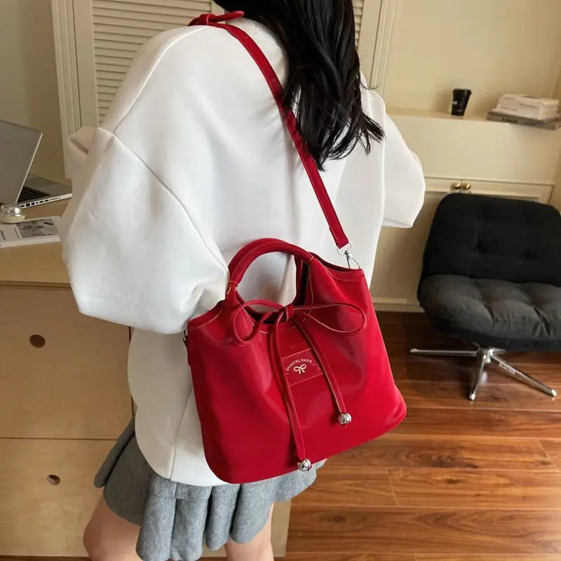 

Милая однотонная сумка с бантом, женская кожаная сумка-ведро большой емкости, женская модная повседневная универсальная сумка через плечо, новинка