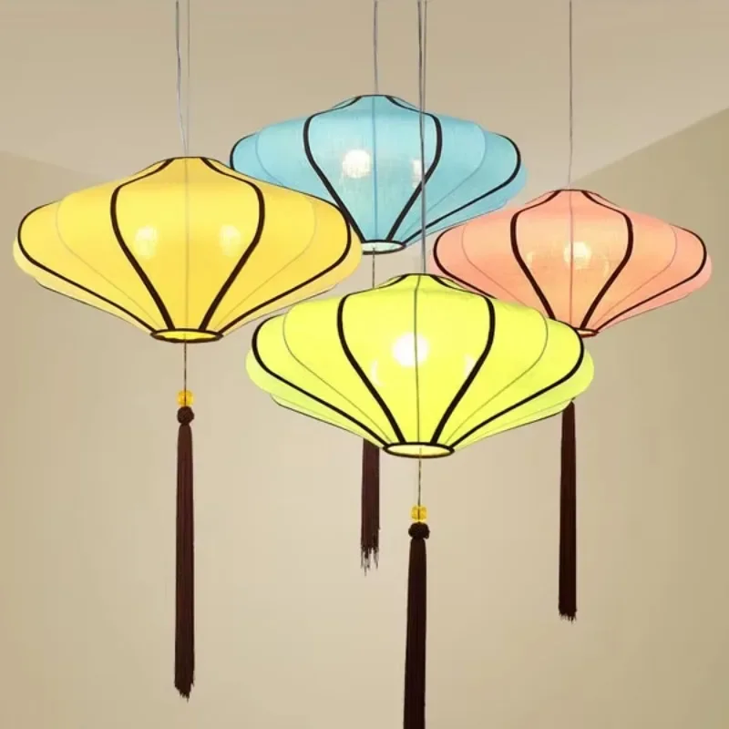 

Hanging lit fabric lanterns