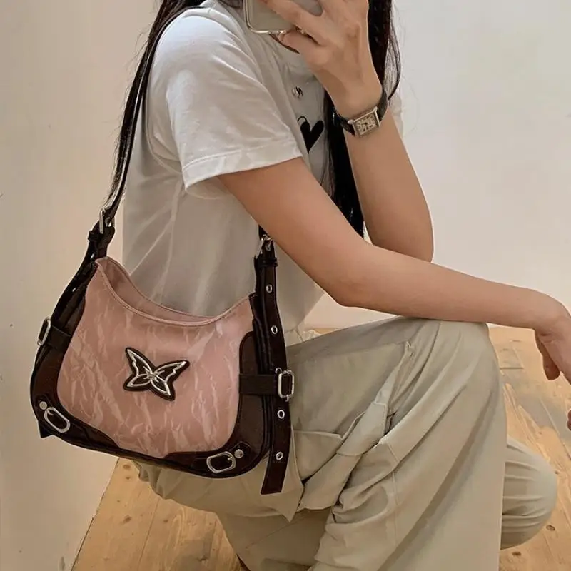 

New Retro Butterfly Contrasting Rivet Locomotive Underarms Bag High -Level Sensor Cordon Messenger Bag