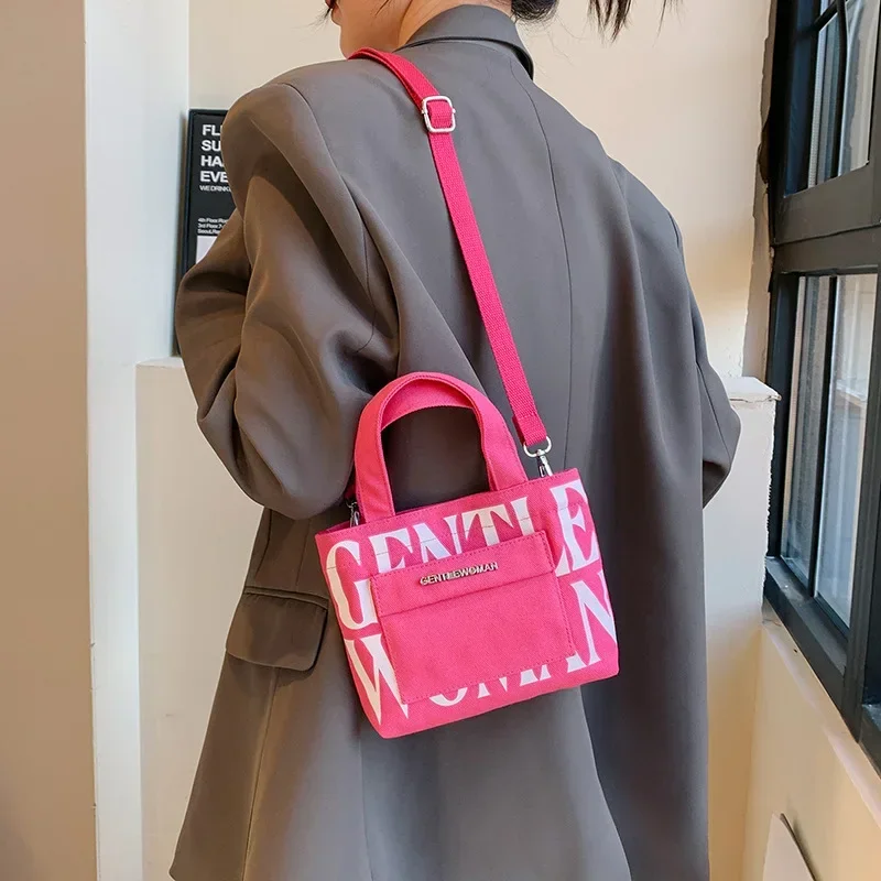 

​​2024 Fashionable Thai Design Canvas Crossbody Bag with Bold Letter Print Smartphone Purse for Women Casual Outings​​