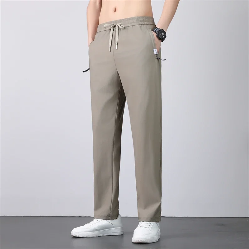 رقيقة تنفس السراويل الرجال 7XL الحرير الجليد الصيف التجفيف السريع فضفاض مستقيم مرونة عالية السراويل الرياضية الركض سراويل تقليدية