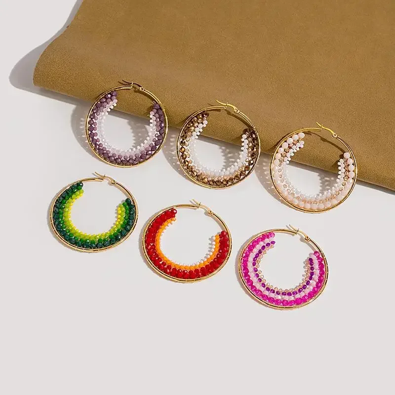 

Rice bead earrings Hand woven fashion circle personality Beading Bohemia alloy ma'am Fringed earrings