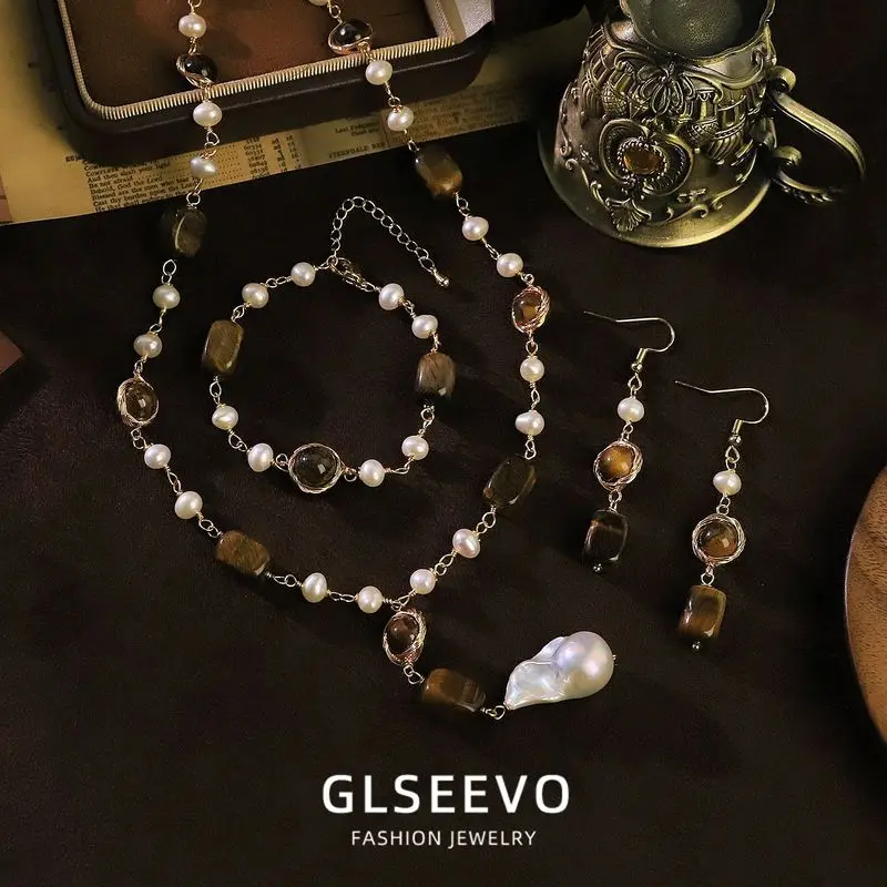 Design: A Set Of Three Pieces Including Earrings A Bracelet A Necklace All Featuring Natural Pearls And Tiger'S