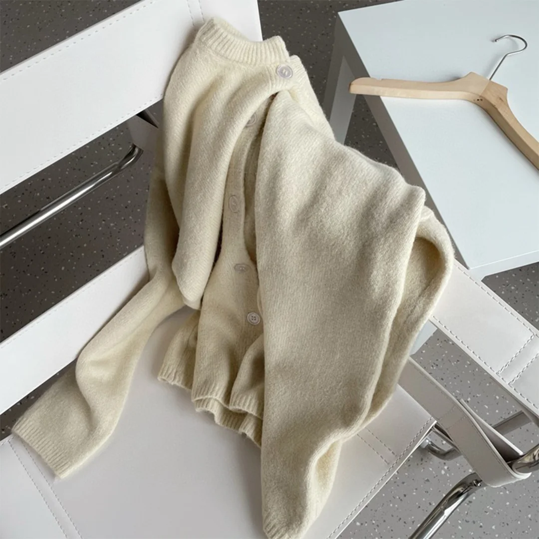 2025 outono/inverno moda suéter de manga comprida com gola assimétrica e bainha irregular para mulheres