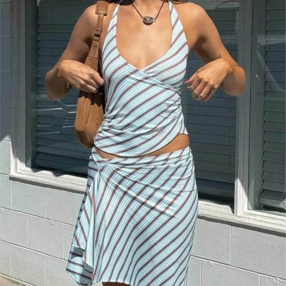 

2026 Summer New Woman 2 Piece Set Outfit Beachwear Arrival Backless Halter Neck Strap Striped Skirt Suit Two Piece Outfits Woman