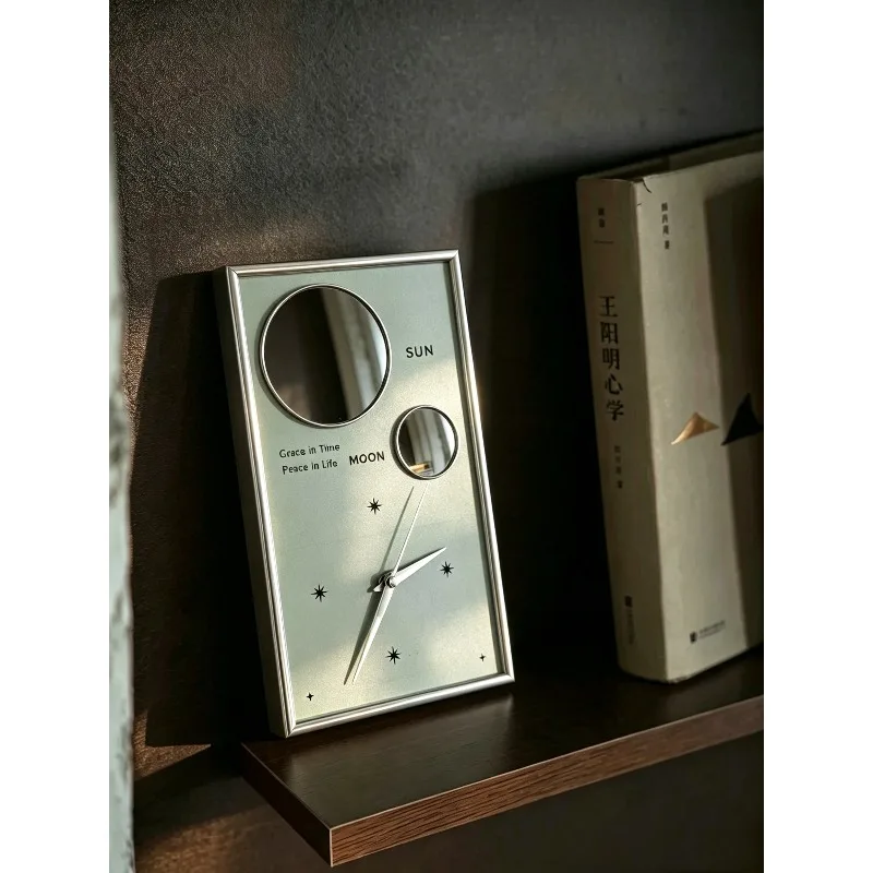 Bauhaus sun and moon silent pendulum clock, modern simple living room home clock niche light luxury bedside table ornament