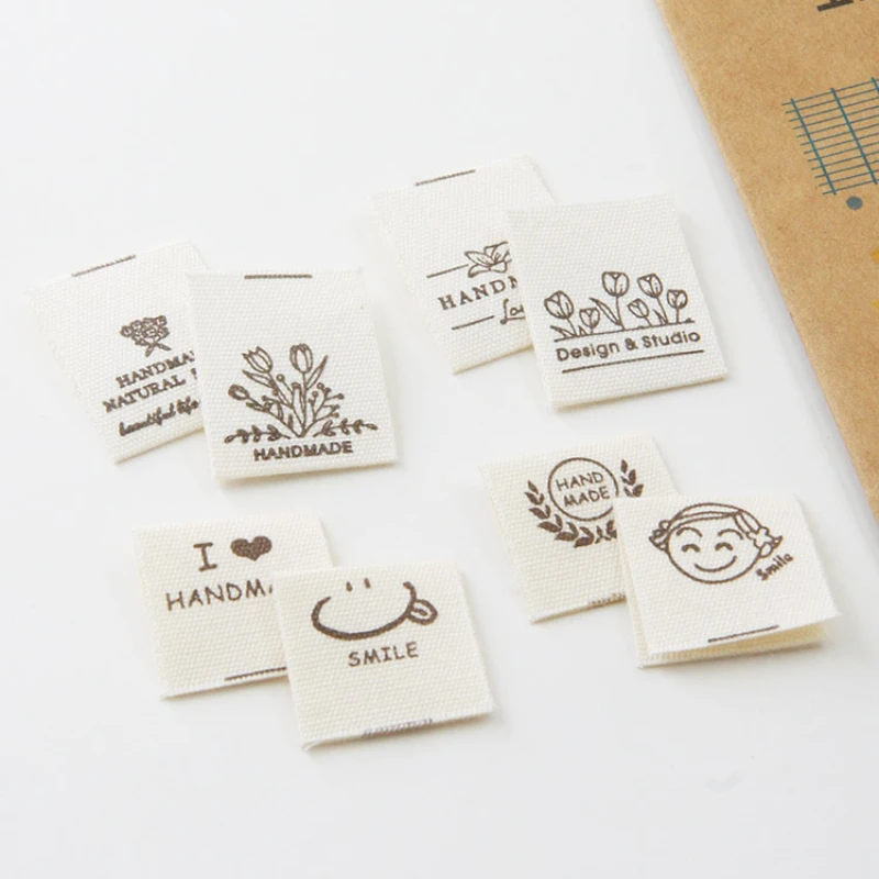 Hand-folded spot shipping mark head tulip bouquet smiling face cloth label accessories sewing DIY side label.