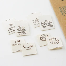 Hand-folded spot shipping mark head tulip bouquet smiling face cloth label accessories sewing DIY side label.