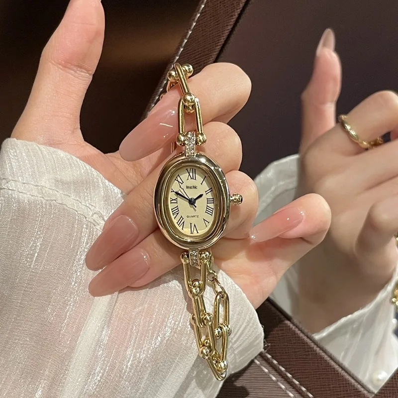 

Ladies Fashion Oval Dial Roman Numerals Quartz Watch Hollow U-Shaped Gold Bracelet Wristwatches High-End Watches Dropshipping