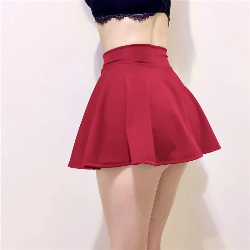 Falda plisada corta Sexy para mujer, minifaldas seductoras húmedas elásticas sin forro para baile, uniforme con tachuelas transpirable ultrafino para Cosplay