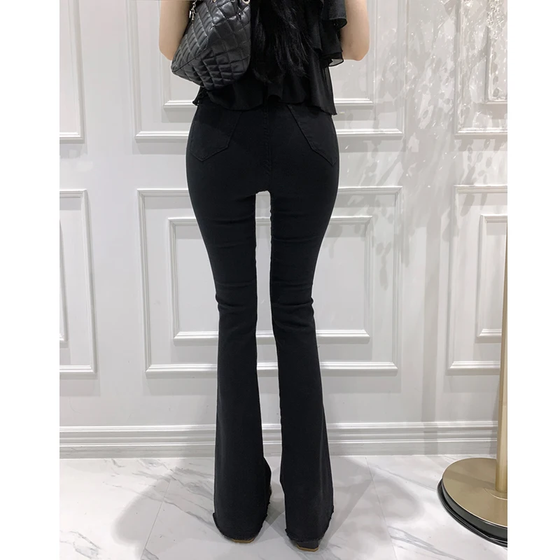 Jeans sexy a vita alta con campana Bot da donna che sollevano il sedere bianco latte semplice coreano Sle pantaloni in denim a gamba lunga in cotone elasticizzato