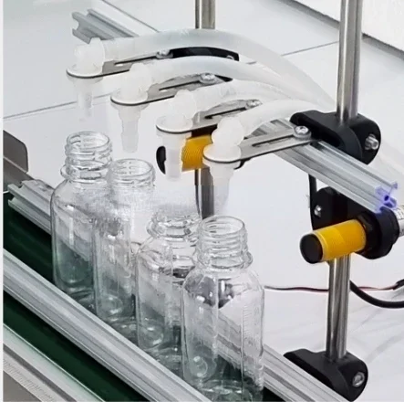 new design oil juice liquid water milk bottle filling machine 4 heads faster delivery time with high quality