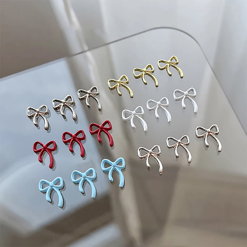 10 pz Kawaii Bowknot metallo oro argento ciondoli per unghie 3D lega papillon gioielli decorazione strass per unghie accessori per Manicure