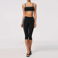 Women’s black sports bra and high-waisted fitness leggings set, shown from the front