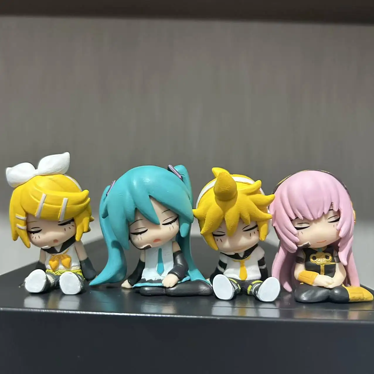

4pcs/set 6cm Anime Hatsune Miku Lin Rin Sitting posture drowsiness Kawaii Figure PVC Model Toys Doll Ornament Gifts