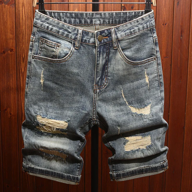 

2025 men's clothing, cool and retro, with ripped patches and scraped denim shorts, men's trendy and fashionable cropped pants