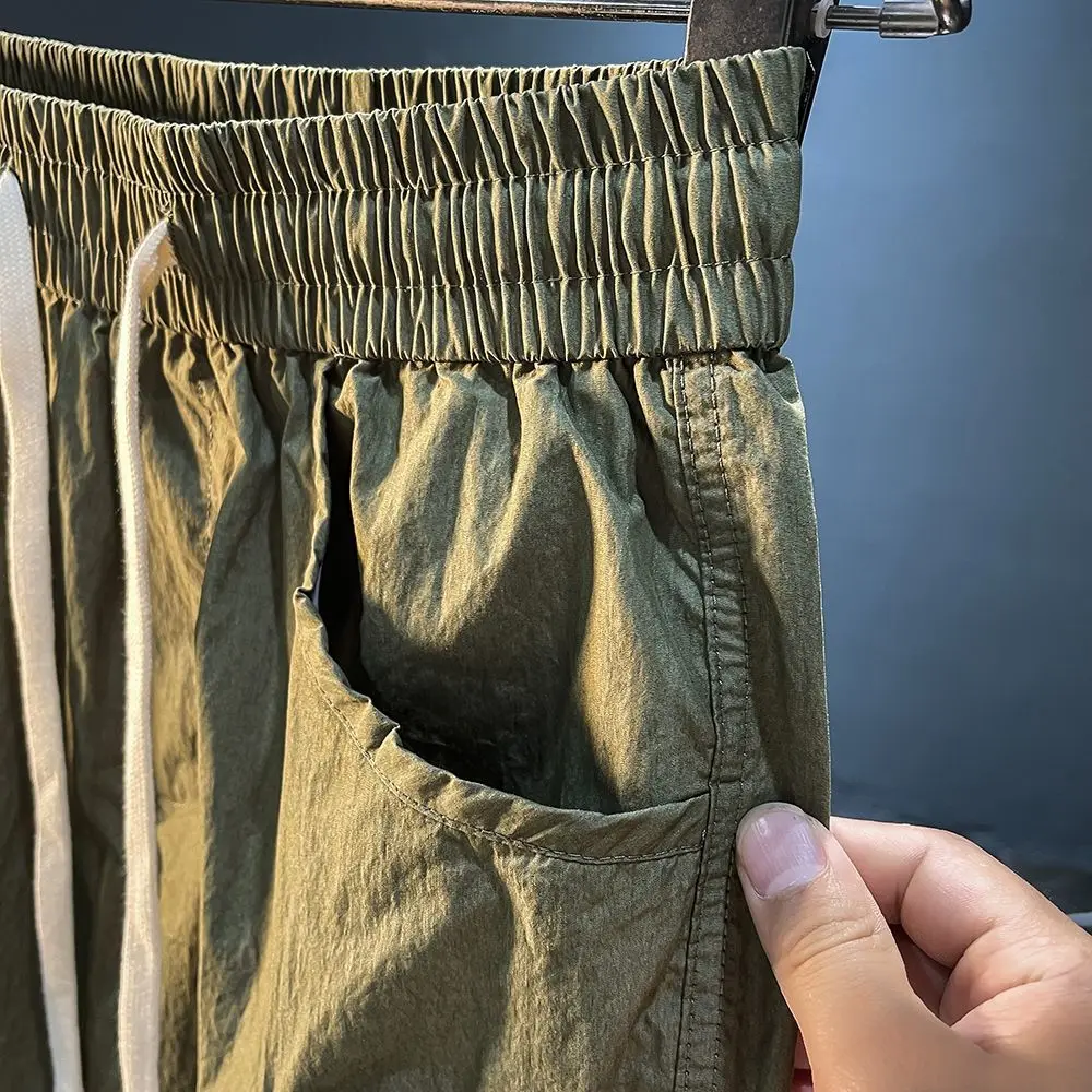 Calça com cordão solta masculina, shorts com cordão, estilo fino, preta, confortável, com tudo a combinar, bolso grande, verão