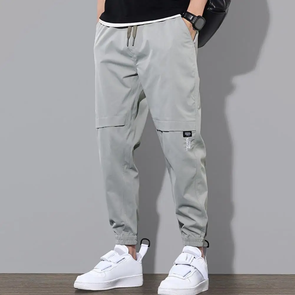 

Loose Trousers Men's Multi-pocket Cargo Pants with Drawstring Waist Ankle-banded Design for Gym Outdoor Activities Daily Wear