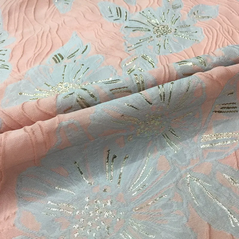 

The fabric of handcrafted dress with gilded pleated jacquard is spring and crisp