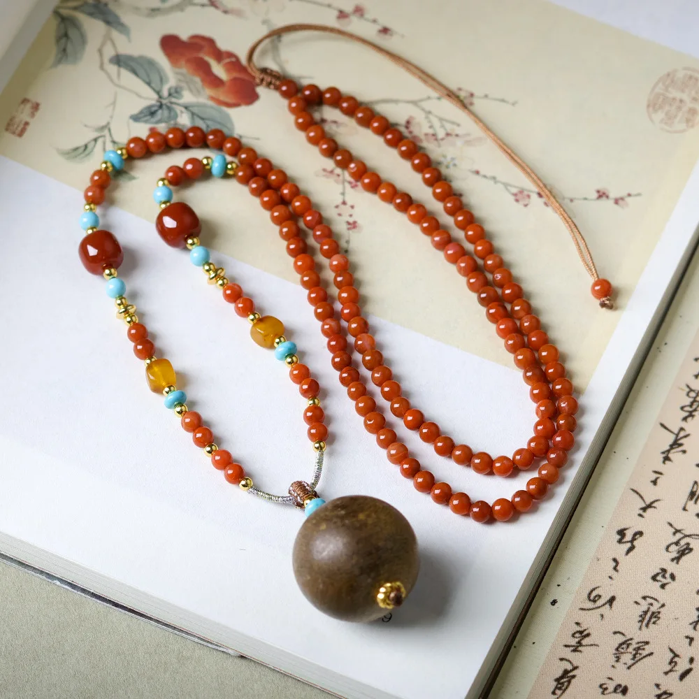 

Original design: South Red Agate paired with Sinking Yellow Qinan pendant necklace Chinese style sweater chain for cultural toys