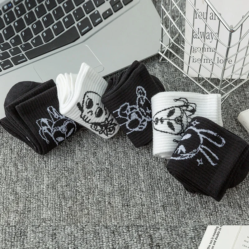 10 pairs of funny little devil pattern socks, casual and personalized, black and white colors suitable for various trendy occasi