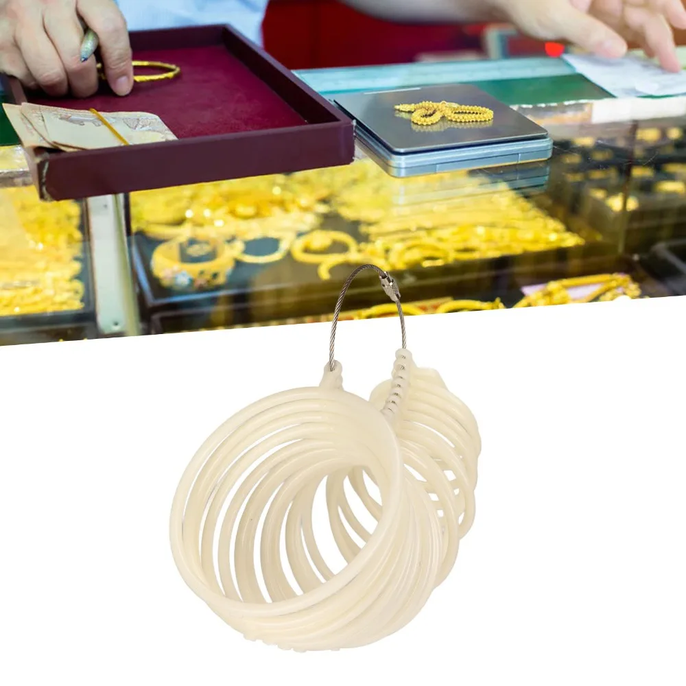 

Белый пластиковый размер браслета Легкий дизайн Регулируемый инструмент Калибр браслета Точные измерения Пластиковый наручный измеритель