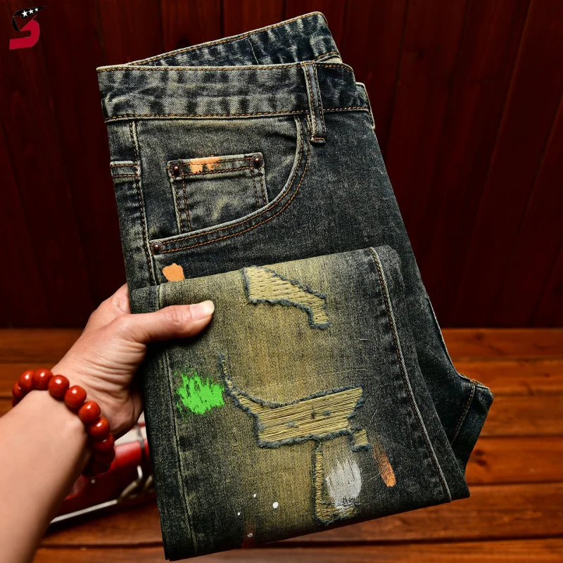 

Мужские рваные джинсы в уличном стиле 2026 года, винтажные джинсовые брюки с принтом в виде брызг краски, модные облегающие эластичные длинные брюки