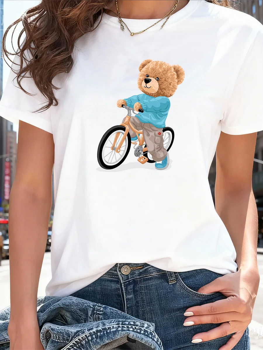 

White Short Sleeve T-Shirt with Cute Brown Teddy Bear Riding Bicycle Graphic for Women Casual Daily Wear