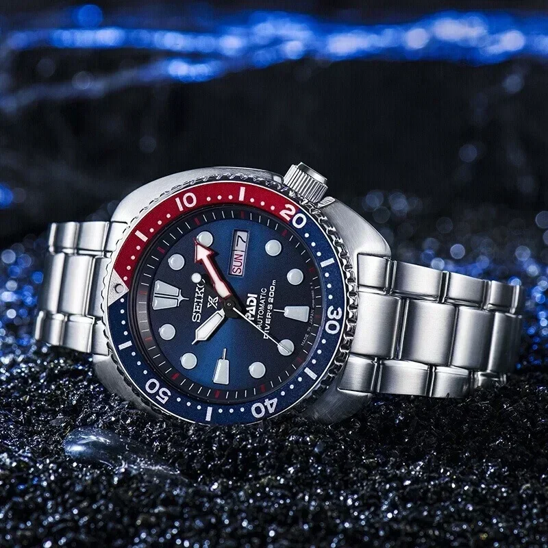 ساعة Seiko للرجال PADI SRPE99 Water Ghost أوتوماتيكية ميكانيكية ساعة غوص بحزام فضي وإطار أزرق وأحمر
