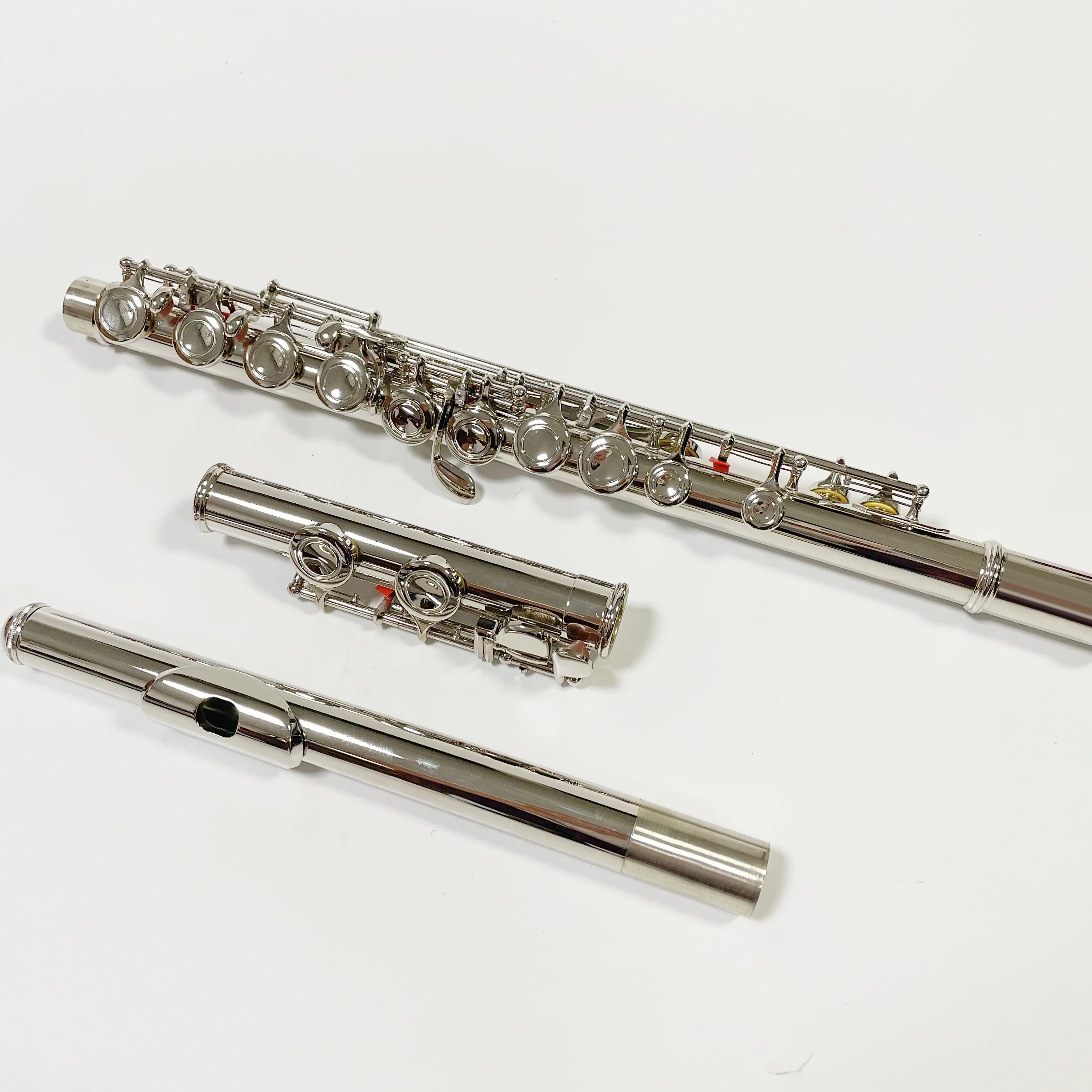 Nickle Plated 16 Key Closed Hole Cheap Cupronickel Concert Flute with E Mechanism
