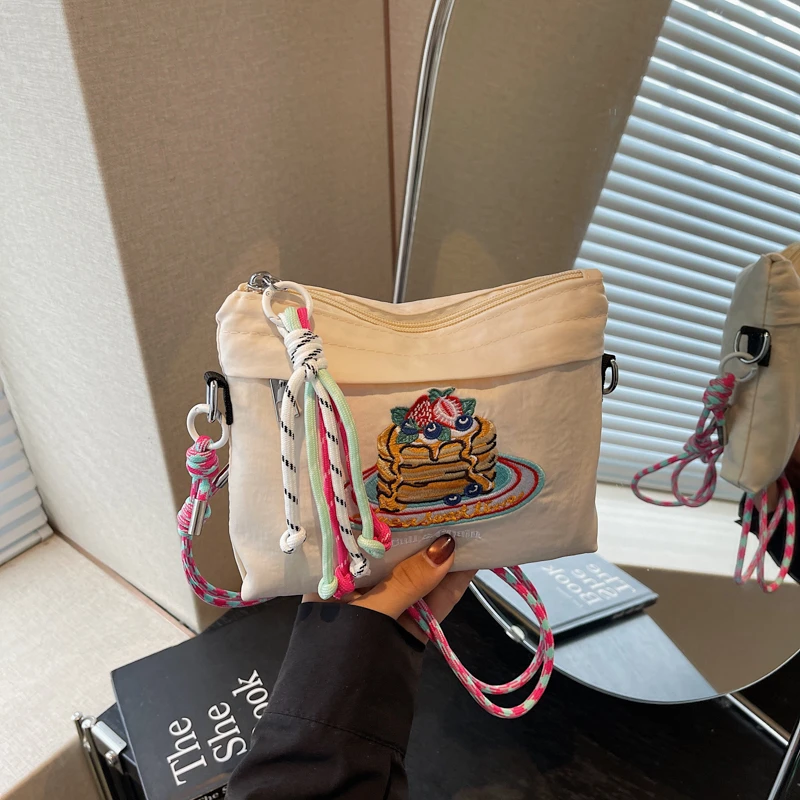 

Japanese-style embroidered shoulder bag for women with a unique design, large capacity, and a slanted cross-body style, small sq