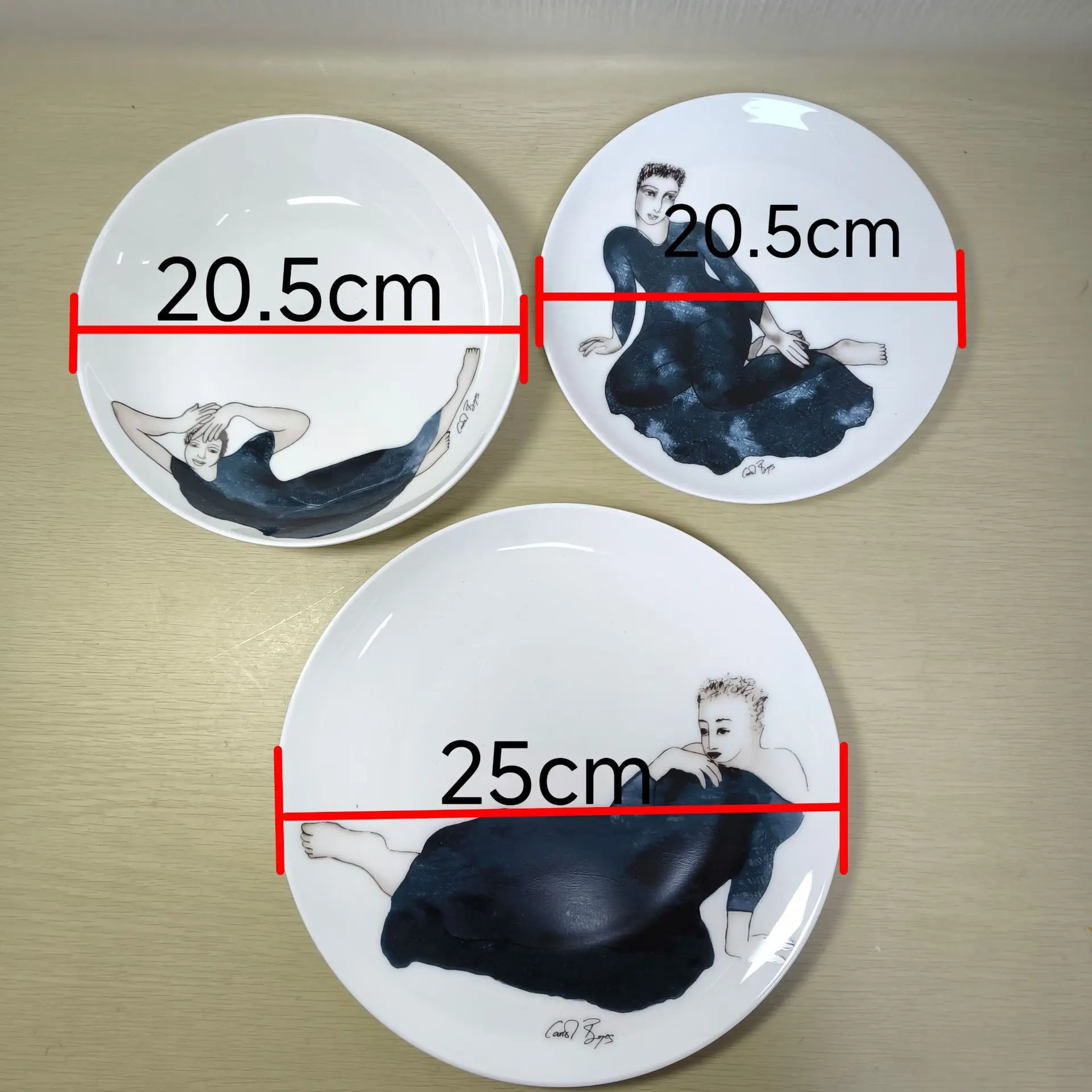 Carrol boyes cutlery tray designer sketches figures, ceramic bowls and plates, bone china cutlery sample room display