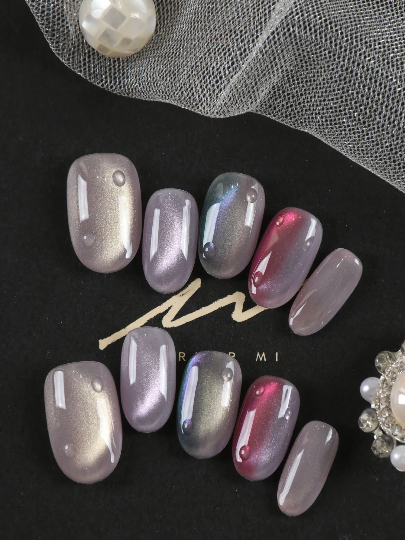 10Pcs Press on Nails Short Purple Pink Green Cat's Eye Fake Nails Includes 1 Sheet of Adhesive Tabs & 1 Pc Mini File