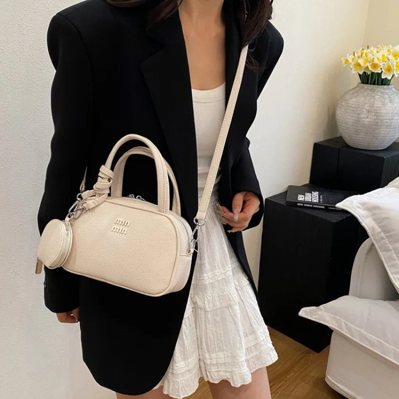 

Trendy Women Bag With Circular Shape And Top Handle Made From Hard Leather For A Fashion Forward Statement