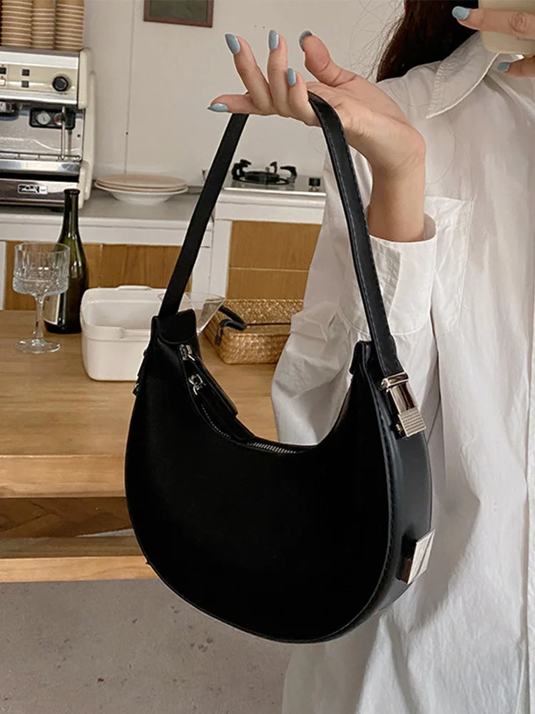 

Simple, Stylish, and Versatile, the Crescent Bag Can Be Carried by Hand or Worn under the Arm