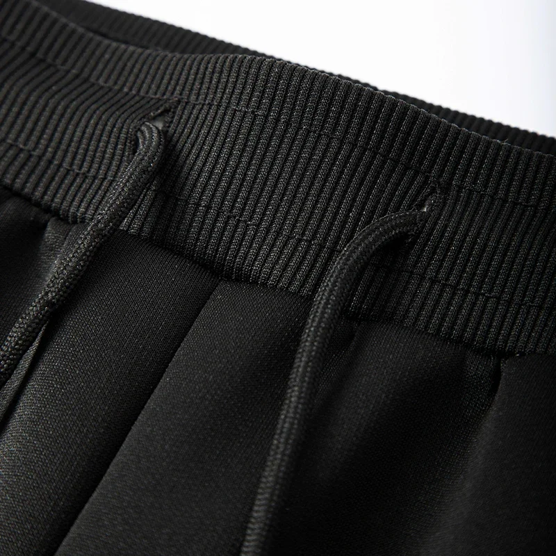 بنطال رياضي رجالي مبطن شيربا دافئ مع جيوب بسحاب شتوي من الصوف الحراري قطيفة بنطال رياضي برباط خصر مرن