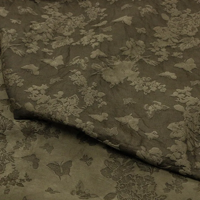 

Plant mud-dyed heavy-weight silk and wool jacquard fabric is made into designer by traditional dyeing methods