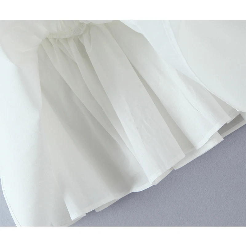 YENKYE ชุดเดรสสีขาวปักลายเซ็กซี่แบบผูกคอสำหรับผู้หญิง ชุดเดรสทรงเอเอวต่ำแบบมินิสำหรับงานปาร์ตี้ฤดูร้อน