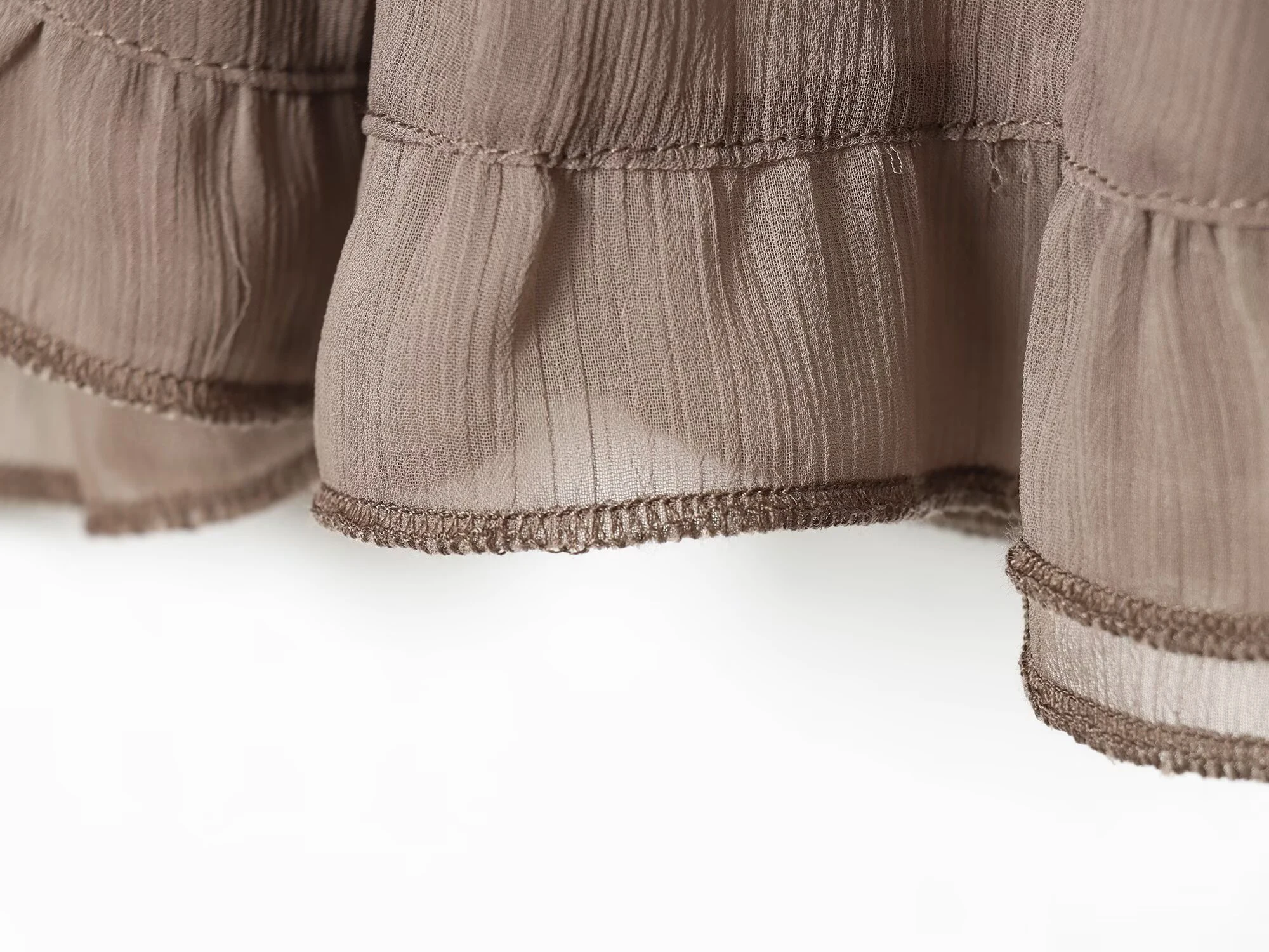 Europäischer und amerikanischer Stil 2026 Sommer Neue Damenmode Mittelhoher Bund Mehrschichtige Dekoration Asymmetrischer Kurzer Rock Halbrock – Detail 7