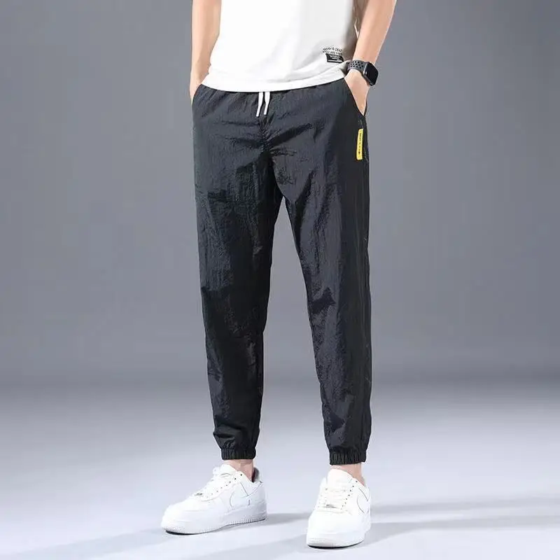 Summer New 2024 Ice Shreds Bound Feet Men Solid Color Pants Loose Casual Comfortable Elastic Waist All-match Nine Point Pants