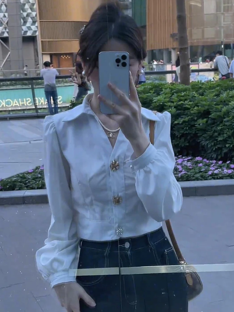 

White Bubble Sve irt Early Autumn Women's Faion 2025 New Unique High-End ort Top Korean Sle Commute Wind Button De...